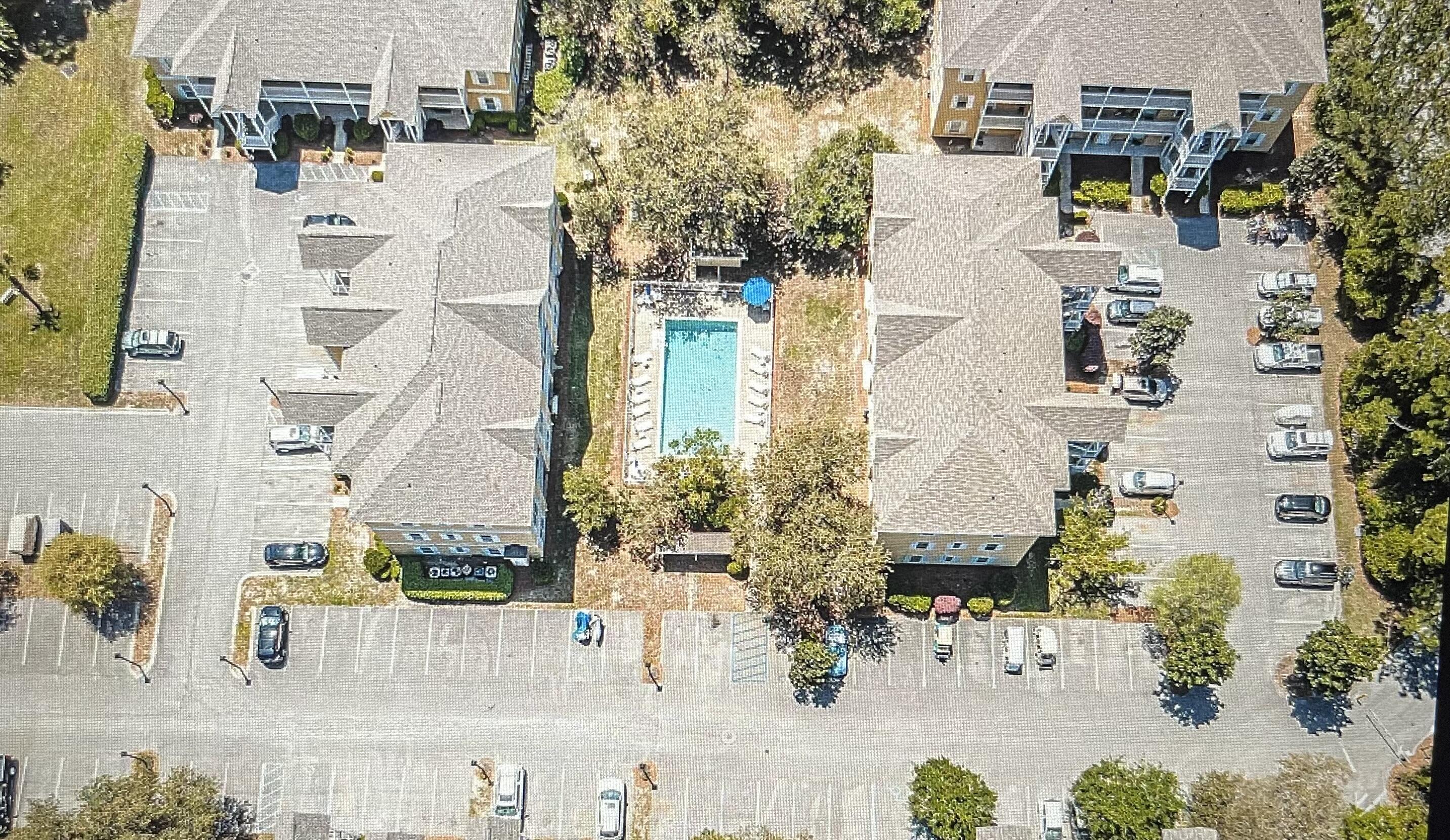 aerial view of residential houses with outdoor space and street view