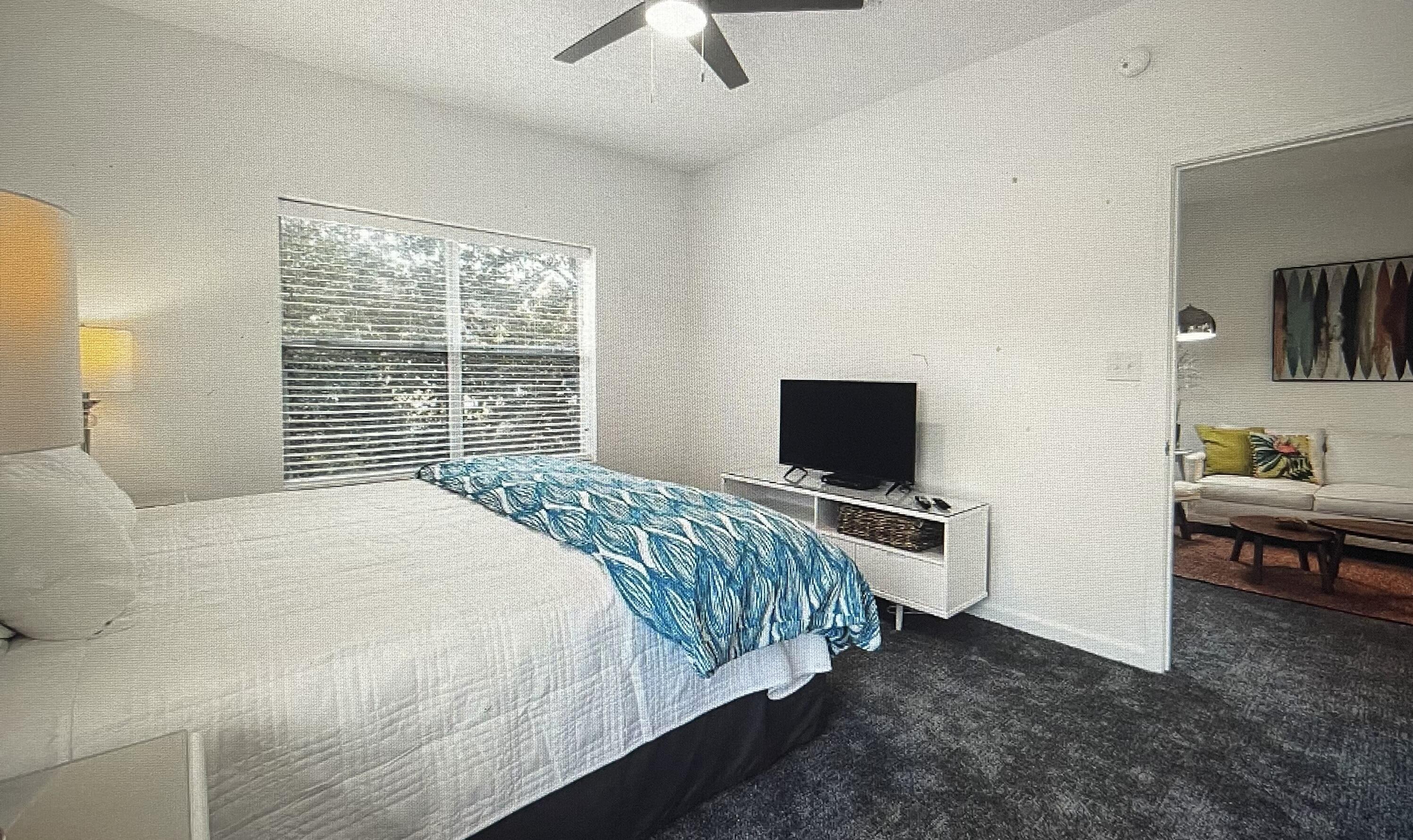 34 Heron's Watch Way, Unit 2304 Santa Rosa Beach, FL 32459 - Photo 12 of 56 a bedroom with a bed and a television