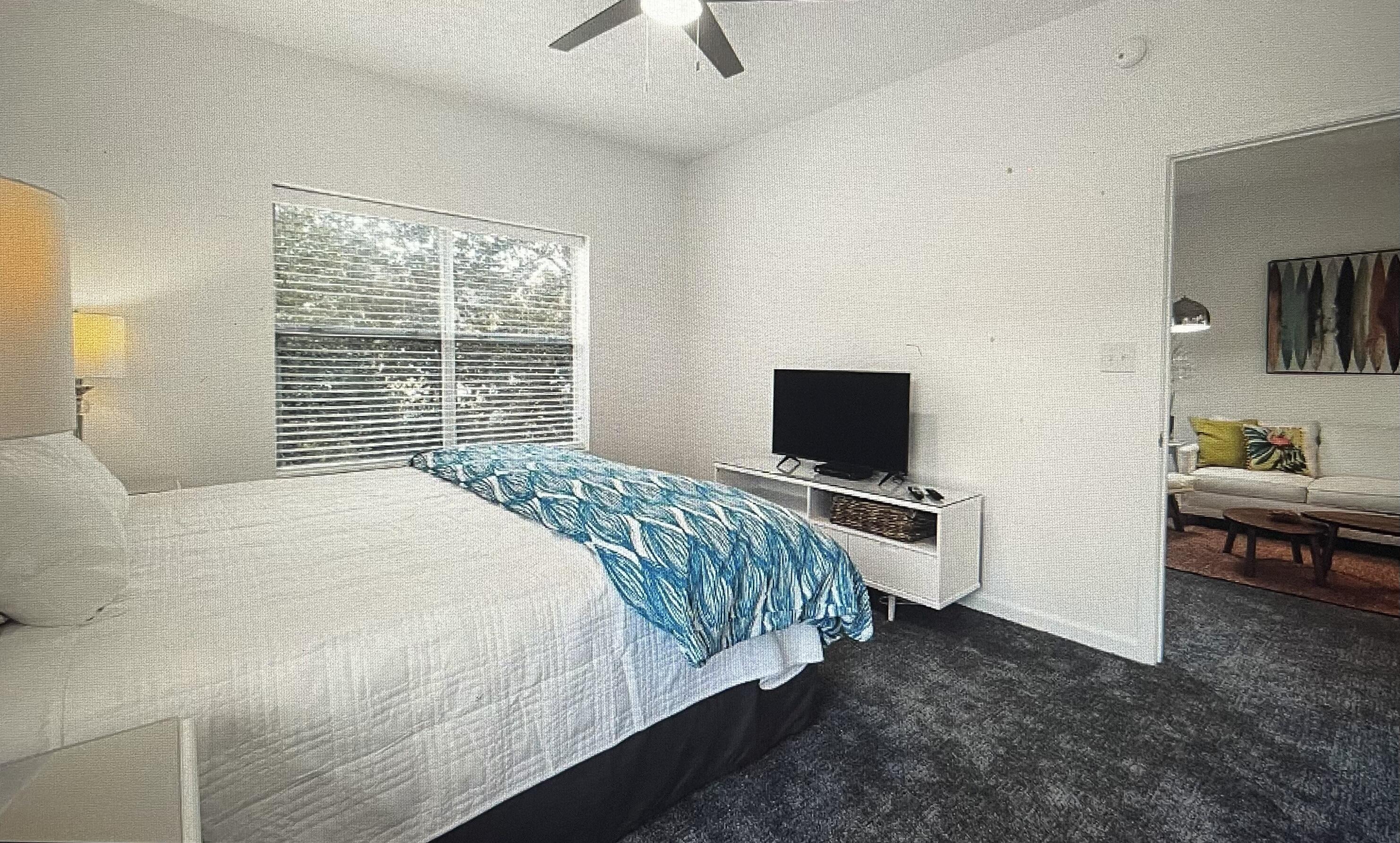 34 Heron's Watch Way, Unit 2304 Santa Rosa Beach, FL 32459 - Photo 13 of 56 a bedroom with a bed and a television