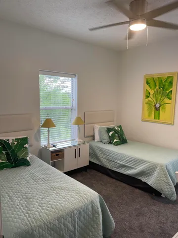 a living room with table chairs and a flat screen tv