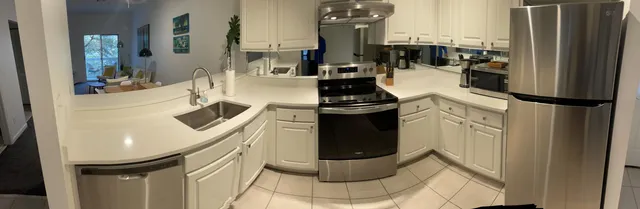 a balcony with furniture and potted plants