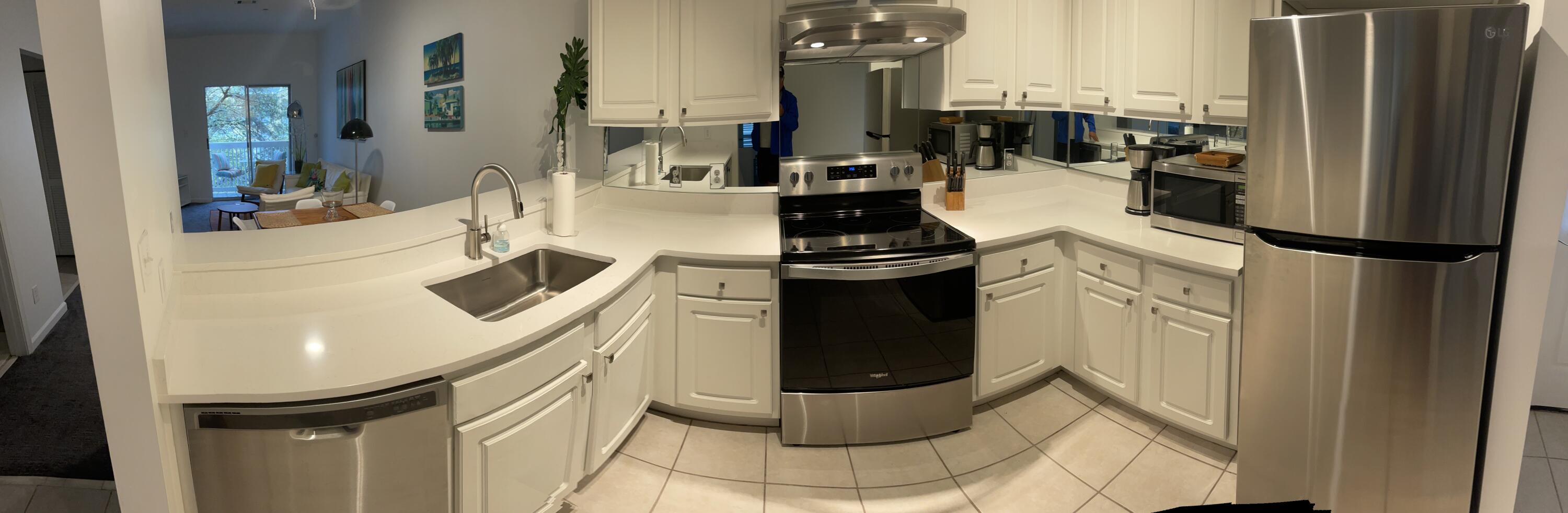 34 Heron's Watch Way, Unit 2304 Santa Rosa Beach, FL 32459 - Photo 42 of 56 a kitchen with a sink appliances and cabinets