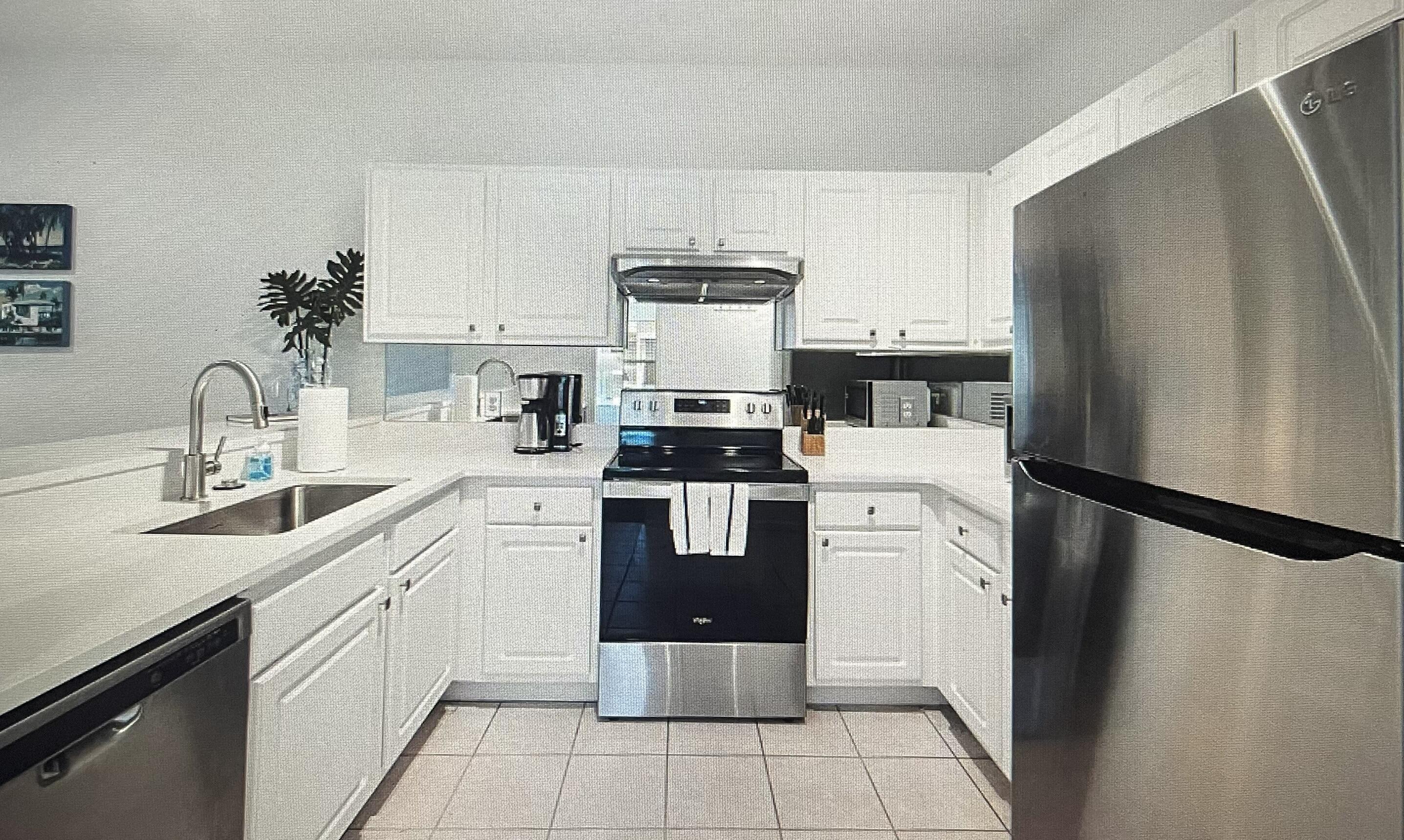 34 Heron's Watch Way, Unit 2304 Santa Rosa Beach, FL 32459 - Photo 5 of 56 a kitchen with a sink stove and refrigerator