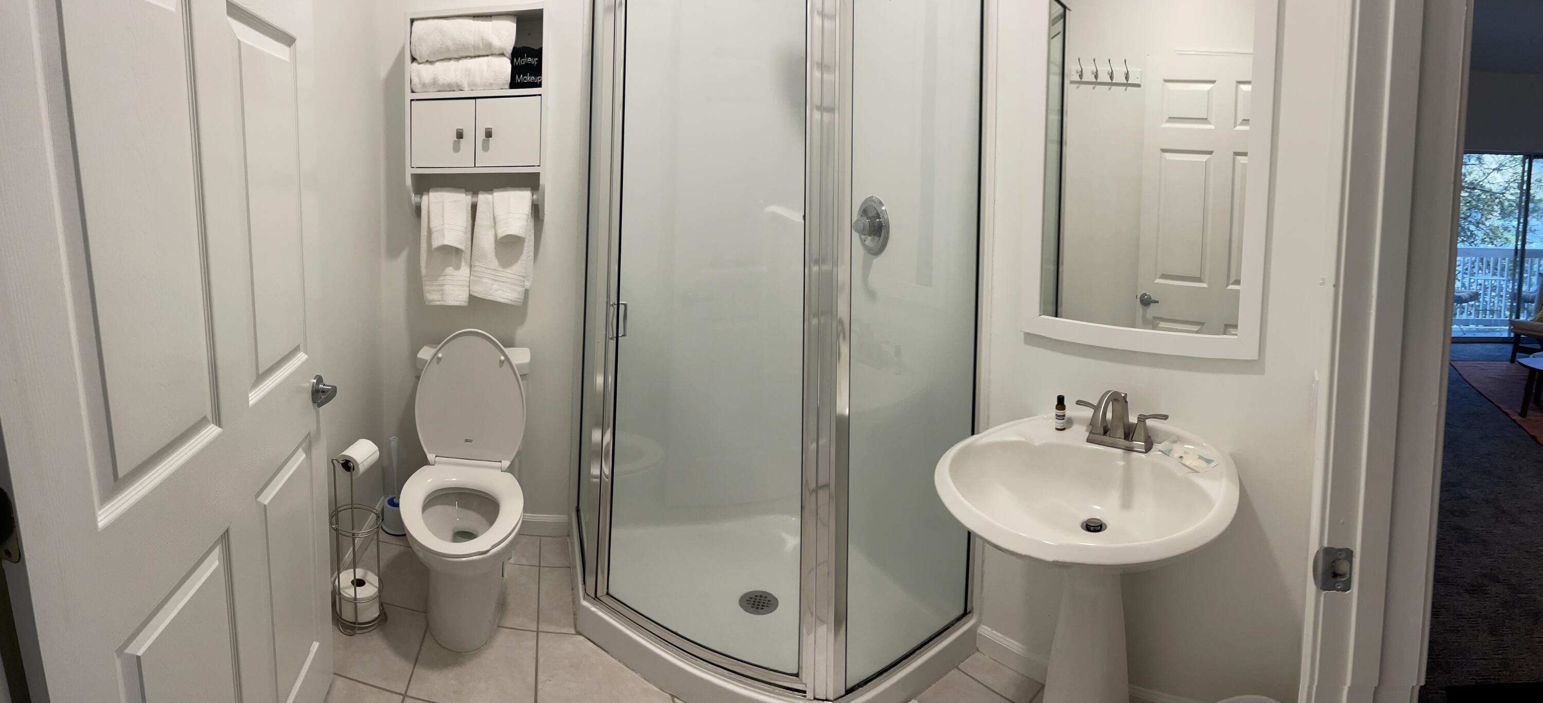 34 Heron's Watch Way, Unit 2304 Santa Rosa Beach, FL 32459 - Photo 52 of 56 a bathroom with a sink a mirror and shower