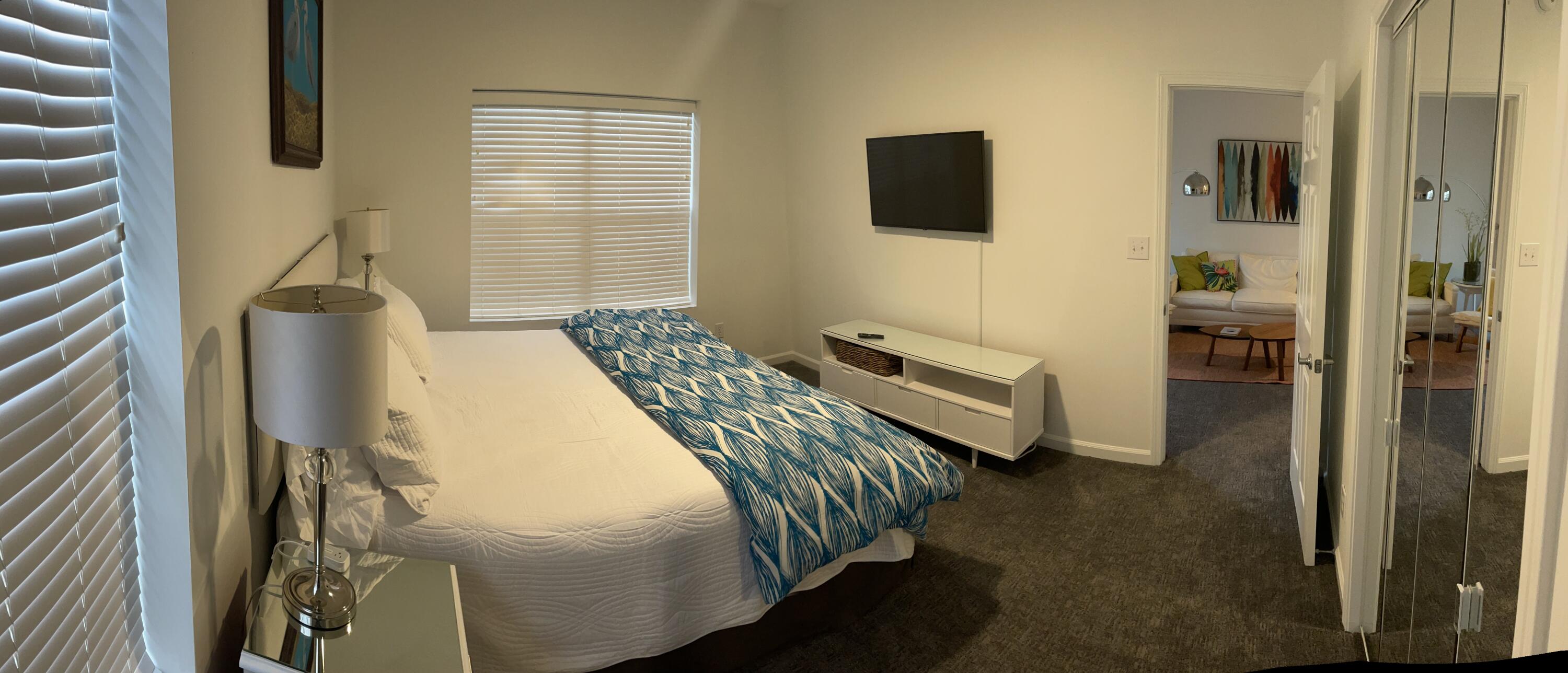 34 Heron's Watch Way, Unit 2304 Santa Rosa Beach, FL 32459 - Photo 56 of 56 a bedroom with a bed and a flat tv screen on the dresser