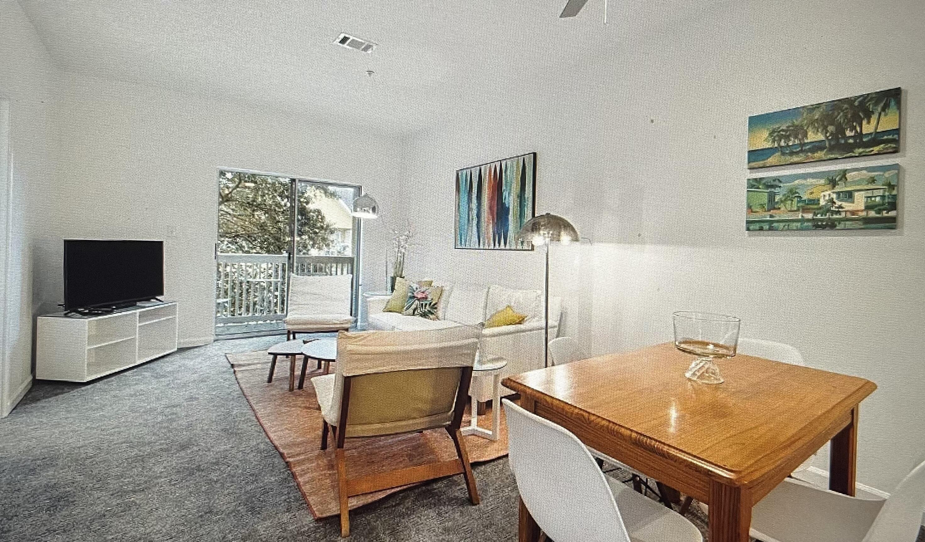 34 Heron's Watch Way, Unit 2304 Santa Rosa Beach, FL 32459 - Photo 9 of 56 a living room with a table and a flat screen tv
