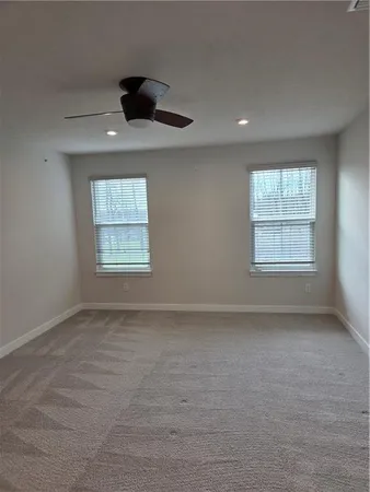 a bathroom with double vanity sink and a mirror