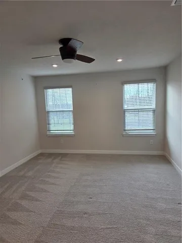 a bathroom with double vanity sink and a mirror