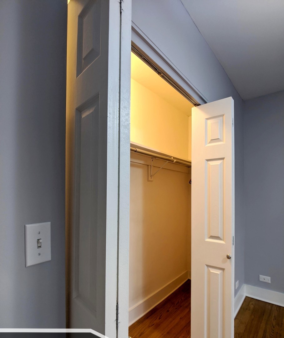 5027 North Harding Avenue, Unit 2W Chicago, IL 60625 - Photo 7 of 20 a view of front door with wooden floor