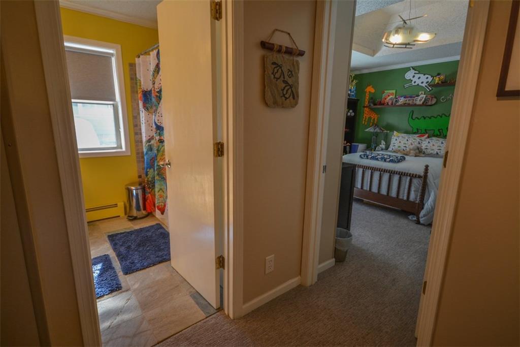 257 Huron Road, Unit E24 Breckenridge, CO 80424 - Photo 17 of 29 a view of a hallway and a livingroom with furniture