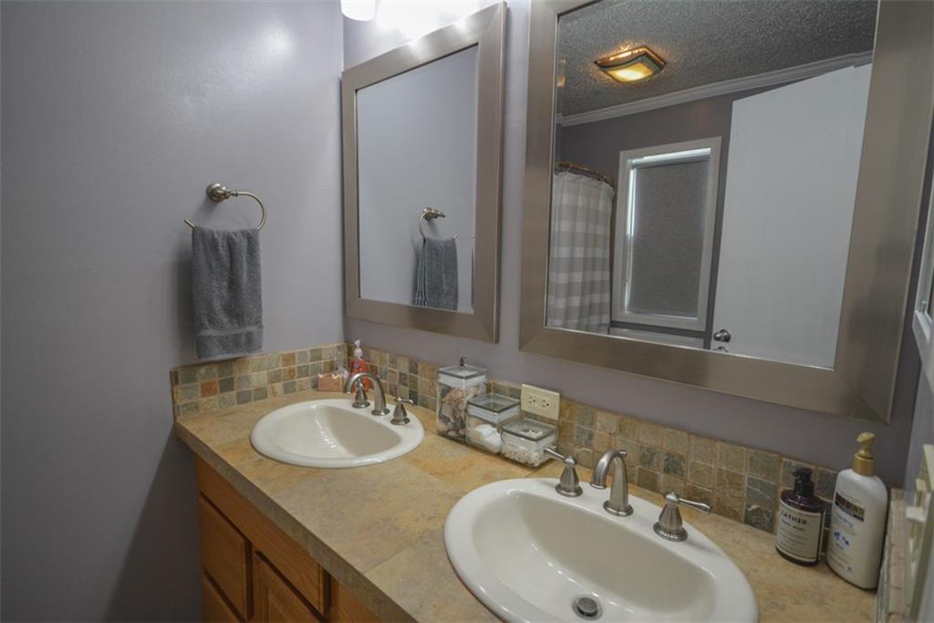 257 Huron Road, Unit E24 Breckenridge, CO 80424 - Photo 21 of 29 a bathroom with double vanity sinks and a mirror