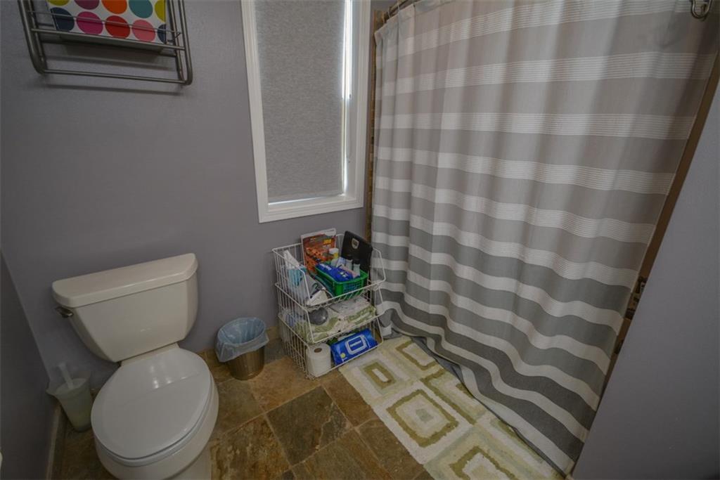 257 Huron Road, Unit E24 Breckenridge, CO 80424 - Photo 22 of 29 a bathroom with a toilet and a shower curtain