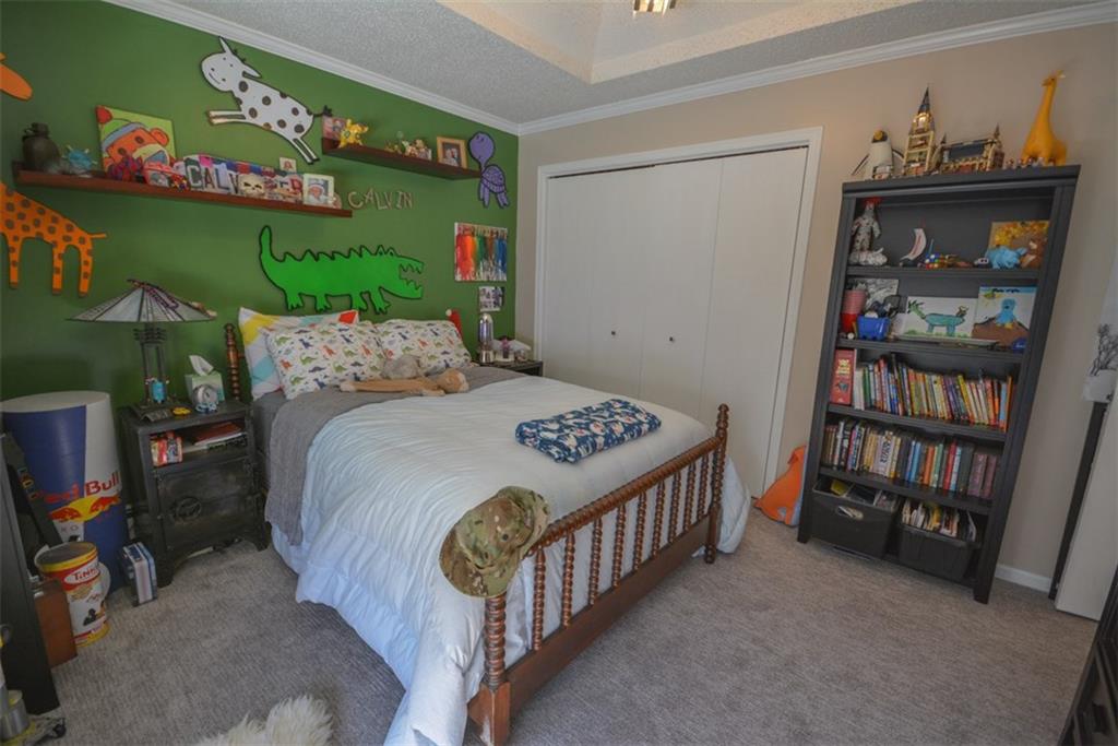 257 Huron Road, Unit E24 Breckenridge, CO 80424 - Photo 25 of 29 a bedroom with a bed and a book shelf