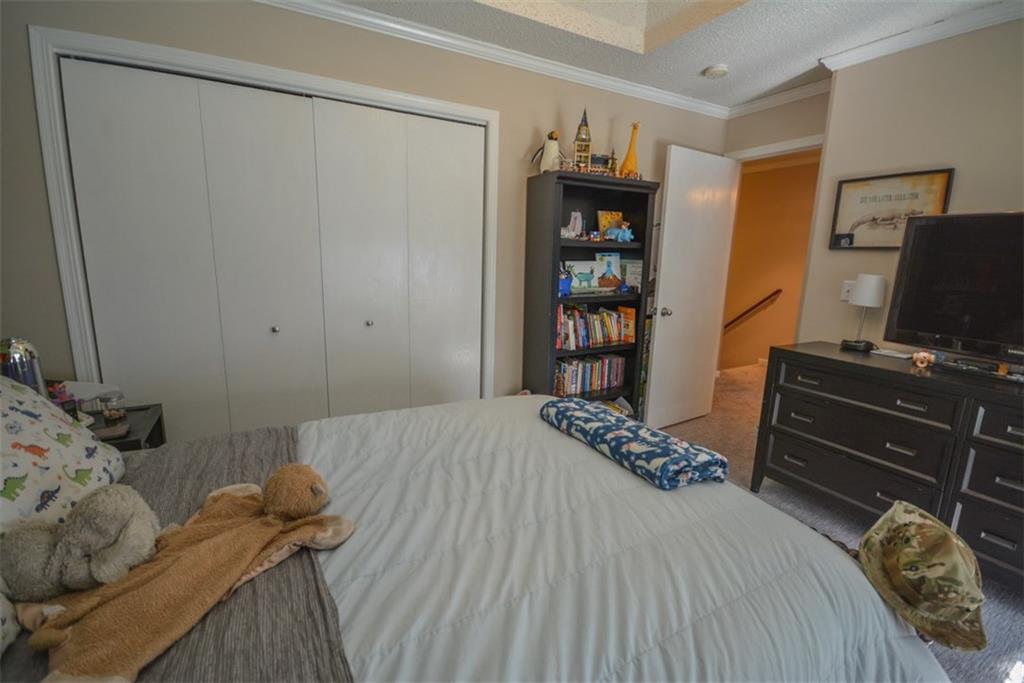 257 Huron Road, Unit E24 Breckenridge, CO 80424 - Photo 26 of 29 a bedroom with a bed and a closet