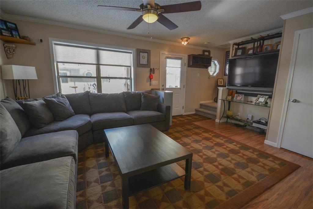 257 Huron Road, Unit E24 Breckenridge, CO 80424 - Photo 6 of 29 a living room with furniture and a flat screen tv