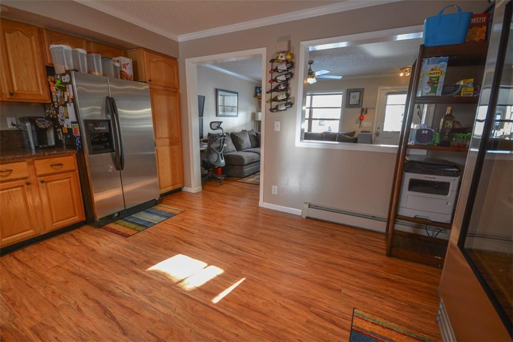 257 Huron Road, Unit E24 Breckenridge, CO 80424 - Photo 10 of 29 a view of a hallway with wooden floor windows and a kitchen