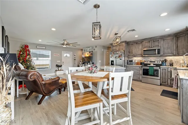a view of a dining room with furniture and wooden floor
