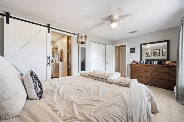 a bedroom with a bed and a dresser