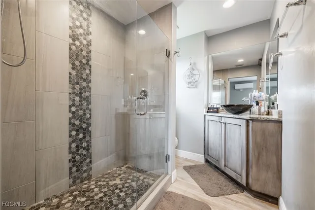 a bathroom with a bathtub and shower