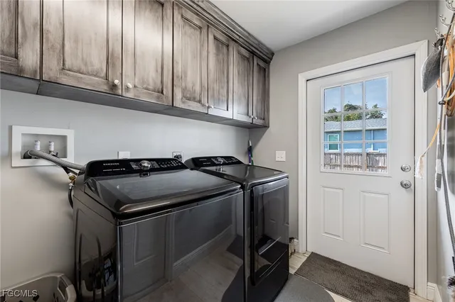 a close view of a sink and cabinets