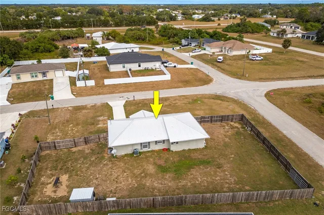 an aerial view of a house with outdoor space