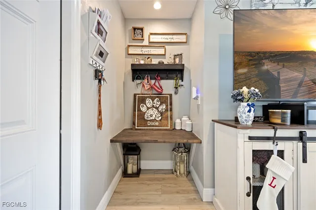 a view of living room kitchen with furniture and flat screen tv