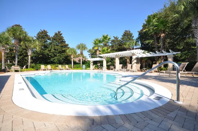 a view of a house with backyard porch and sitting area