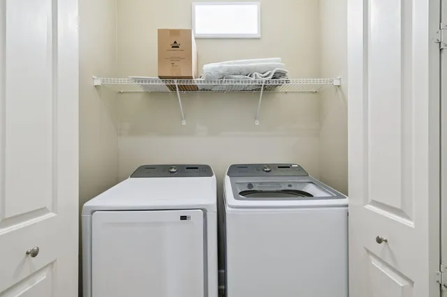 a utility room with dryer and washer