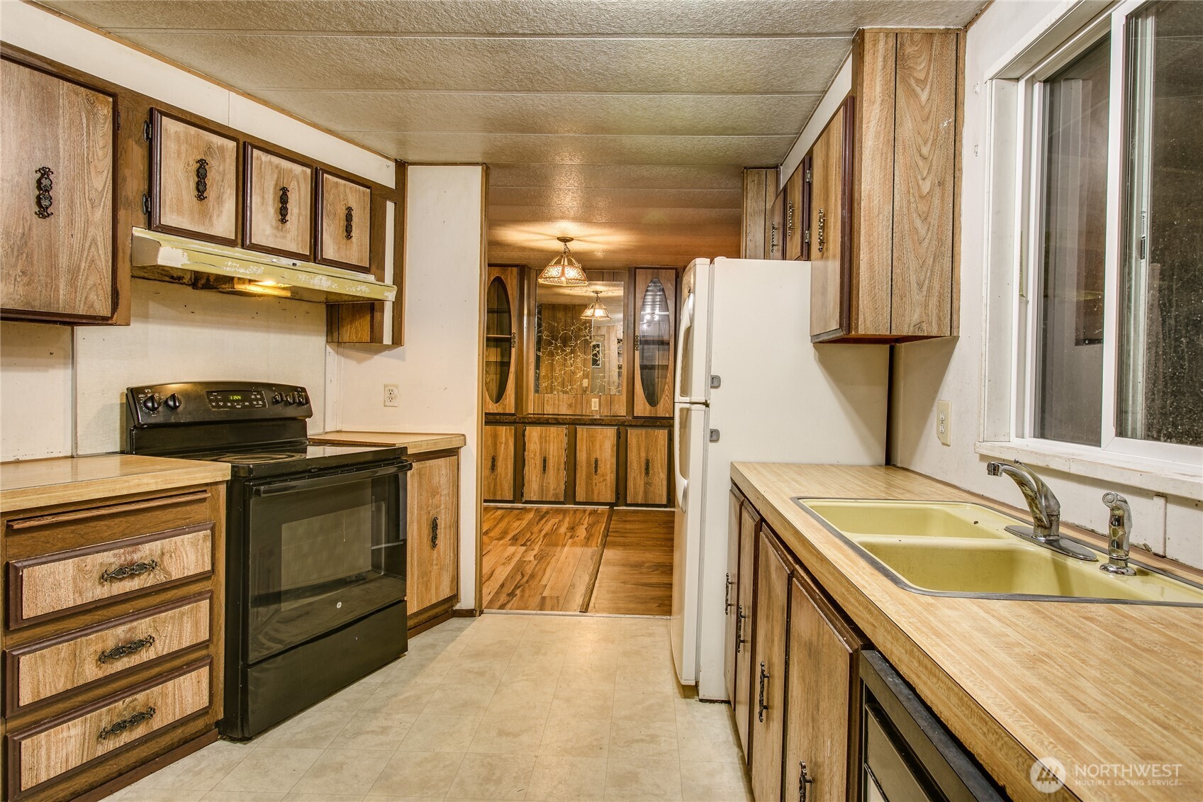 3496 Birch Bay Lynden Road Custer, WA 98240 - Photo 12 of 24 a kitchen with stainless steel appliances granite countertop a sink stove and refrigerator