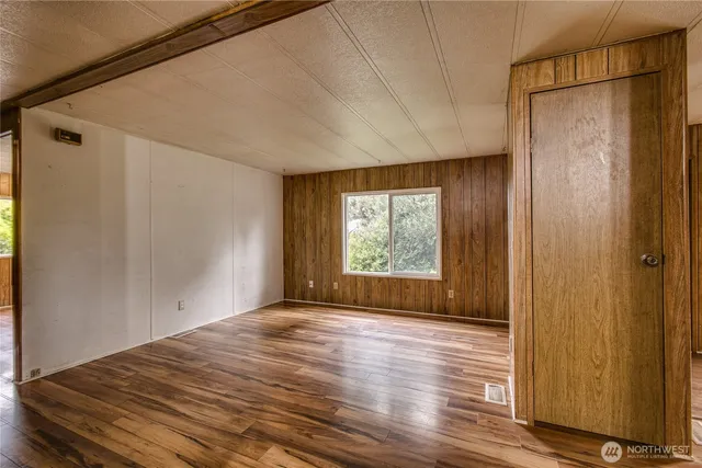 a view of a bathroom with wooden floor and a sink