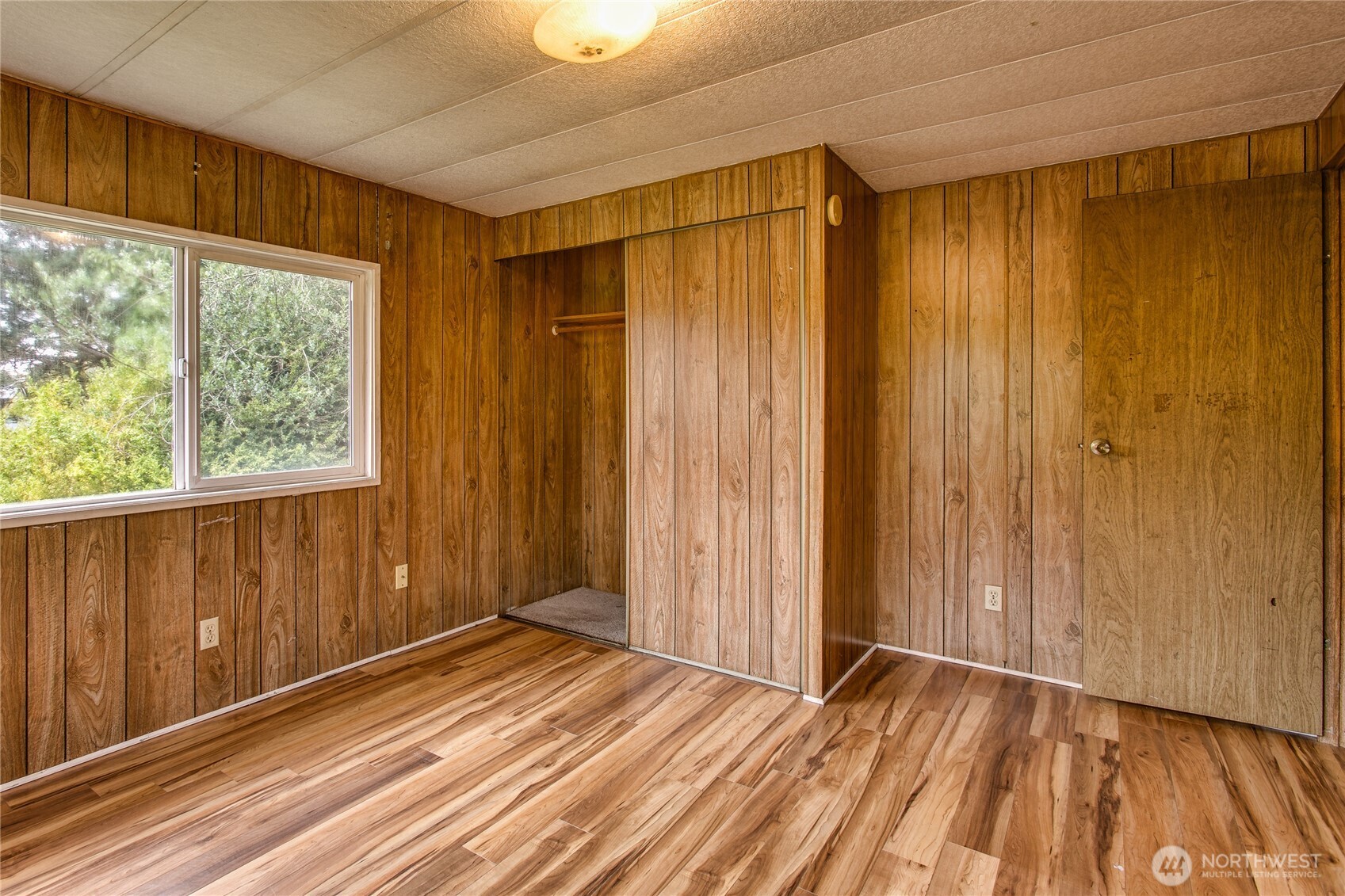 3496 Birch Bay Lynden Road Custer, WA 98240 - Photo 15 of 24 a view of a room with wooden floor and a window