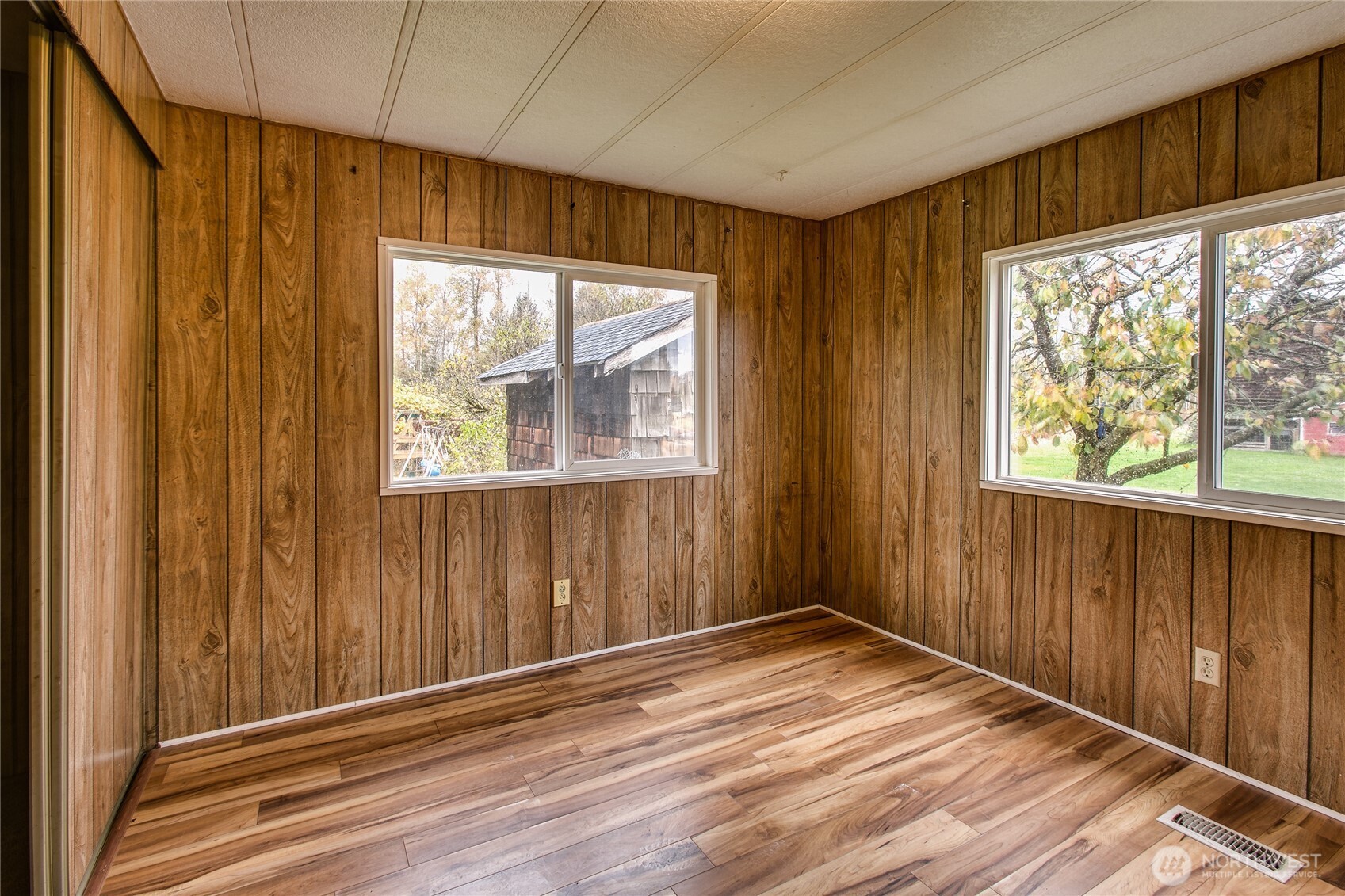 3496 Birch Bay Lynden Road Custer, WA 98240 - Photo 16 of 24 an empty room with wooden floor and windows