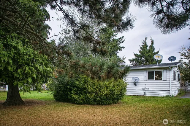 a backyard of a house with lots of green space