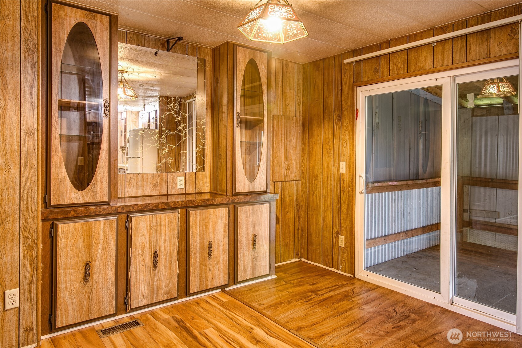 3496 Birch Bay Lynden Road Custer, WA 98240 - Photo 10 of 24 a view of an empty room with wooden floor and windows