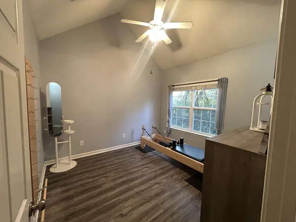 a room with wooden floor and window
