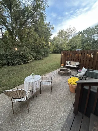 a view of a table and chairs on the roof deck