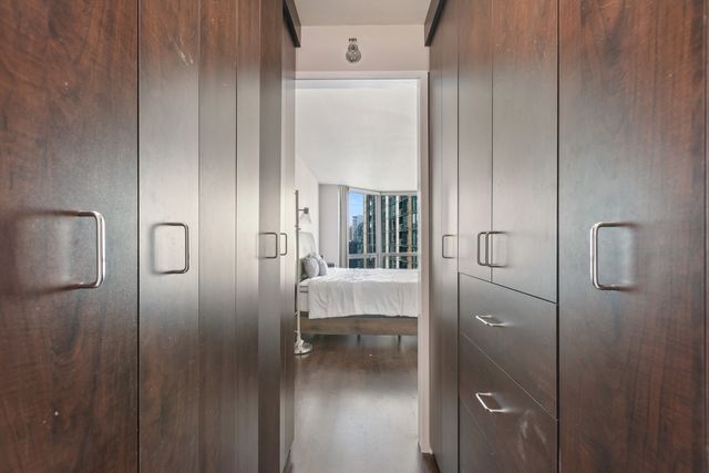 a bathroom with a glass shower door