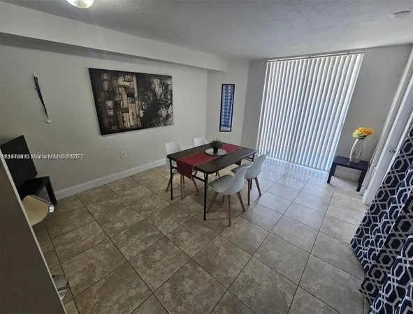 a living room with furniture a piano and a window