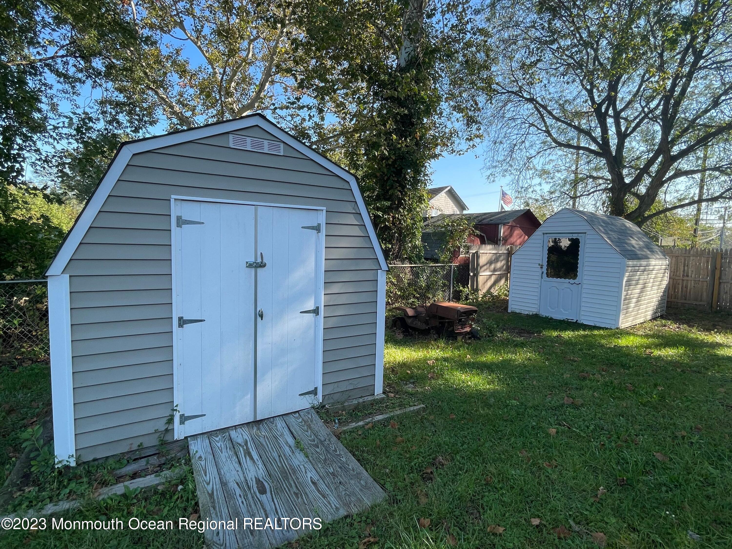 509 Stone Road Union Beach, NJ 07735 - Photo 12 of 12 a backyard of a house with seating space