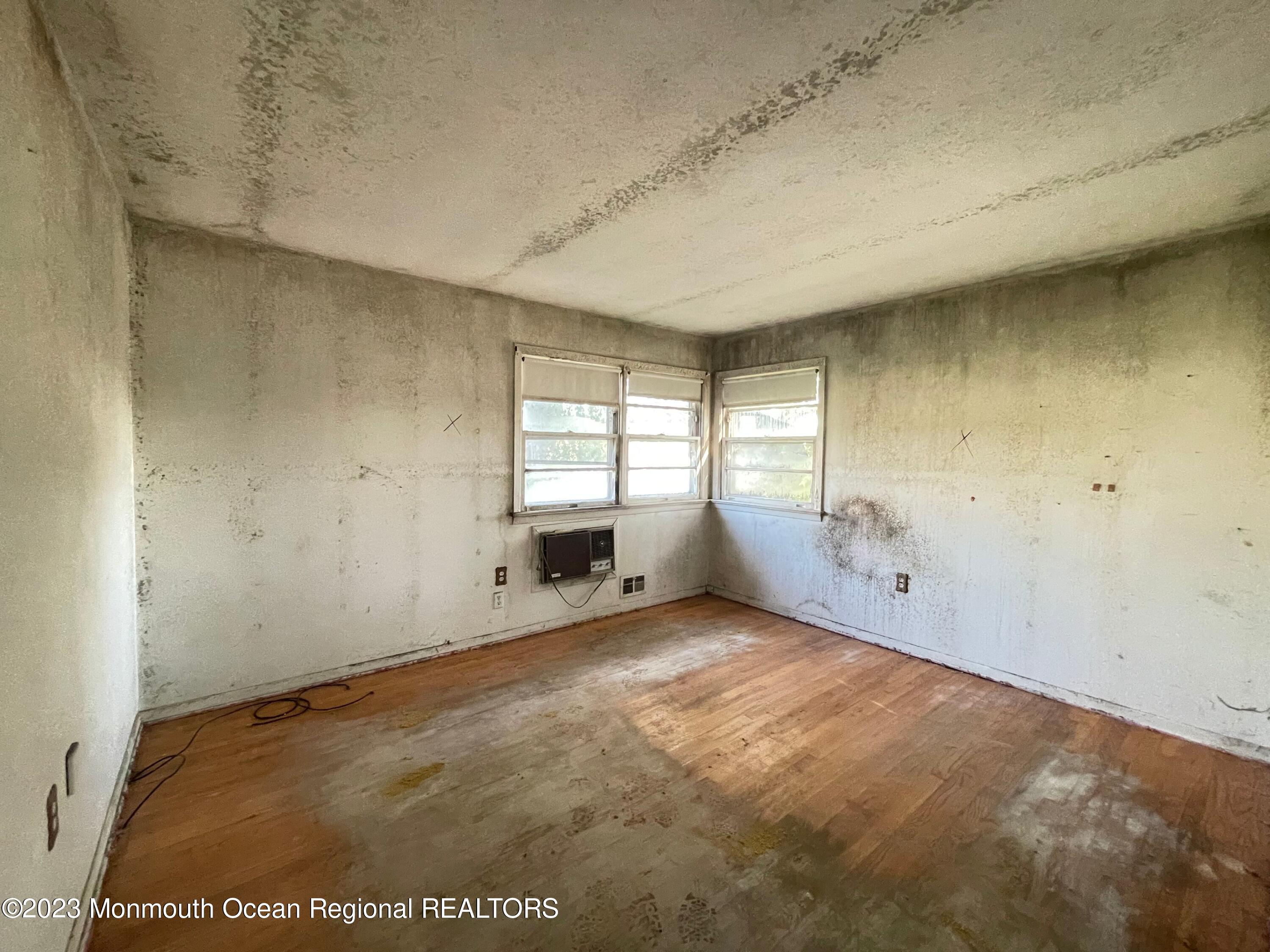 509 Stone Road Union Beach, NJ 07735 - Photo 5 of 12 an empty room with windows