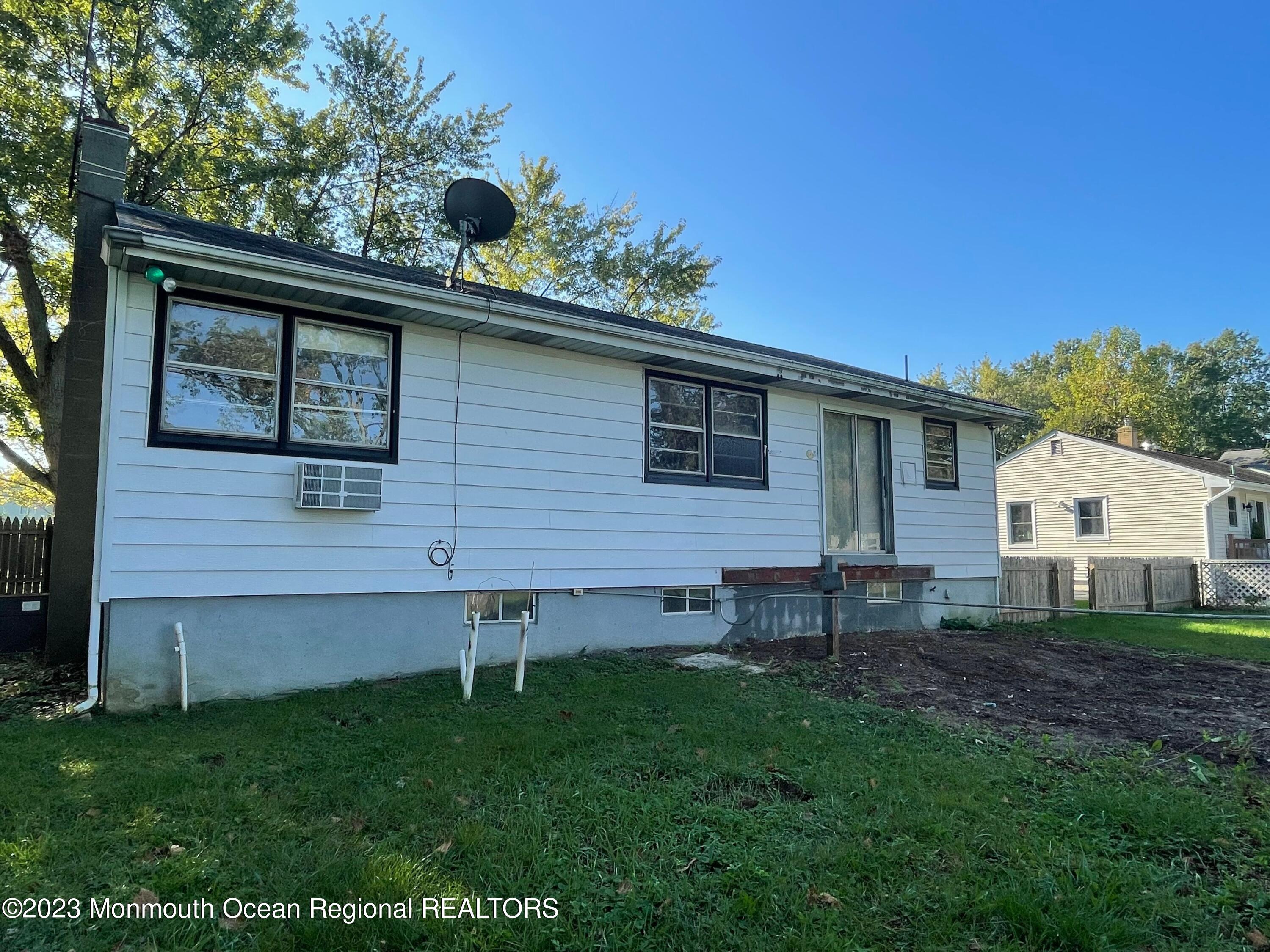 509 Stone Road Union Beach, NJ 07735 - Photo 10 of 12 a backyard of a house with table and chairs