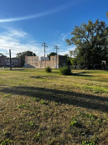 a view of a big yard next to a yard