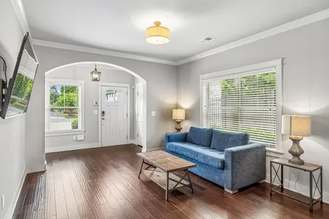 a living room with furniture and a window