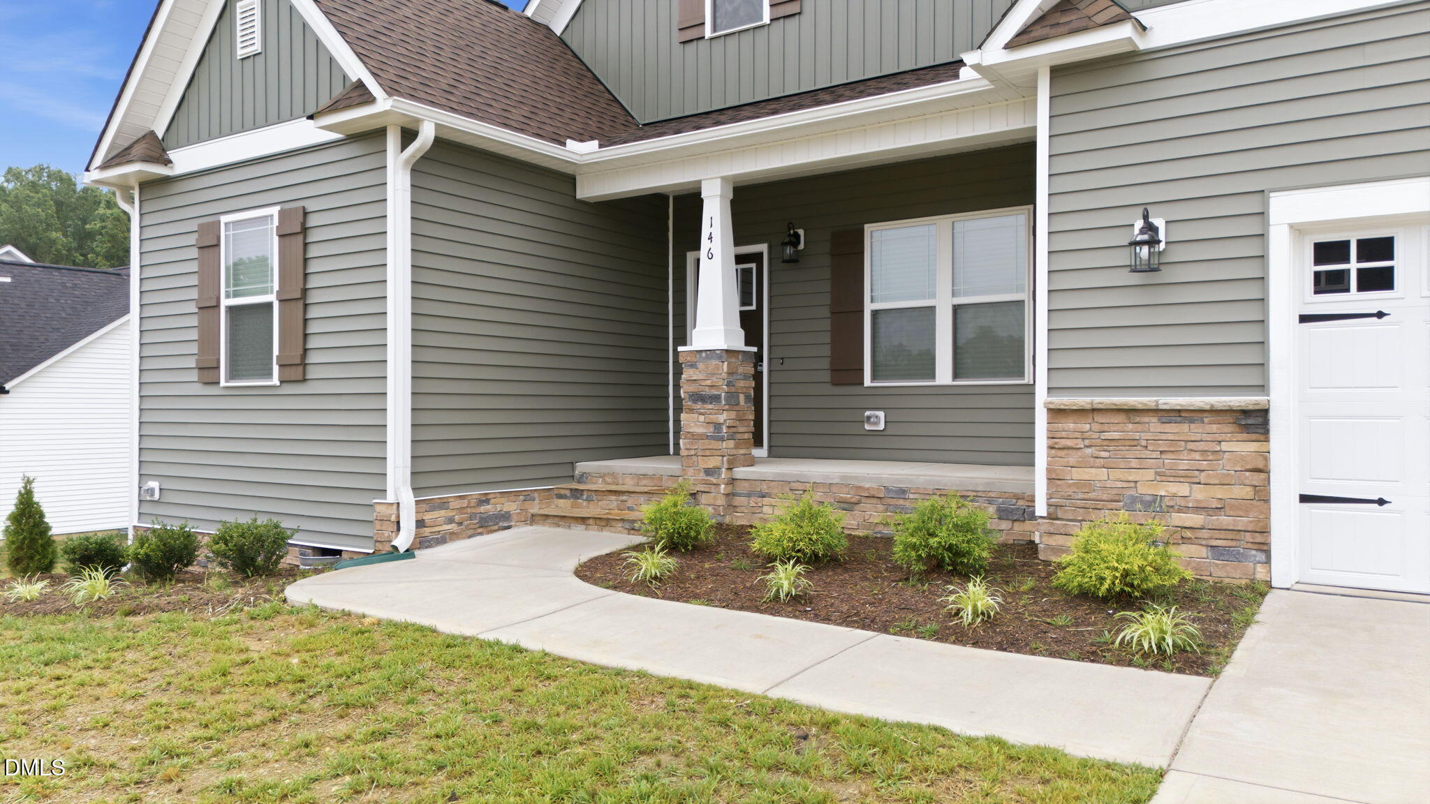 146 Seahawk Way Zebulon, NC 27597 - Photo 4 of 51 a front view of a house with garden
