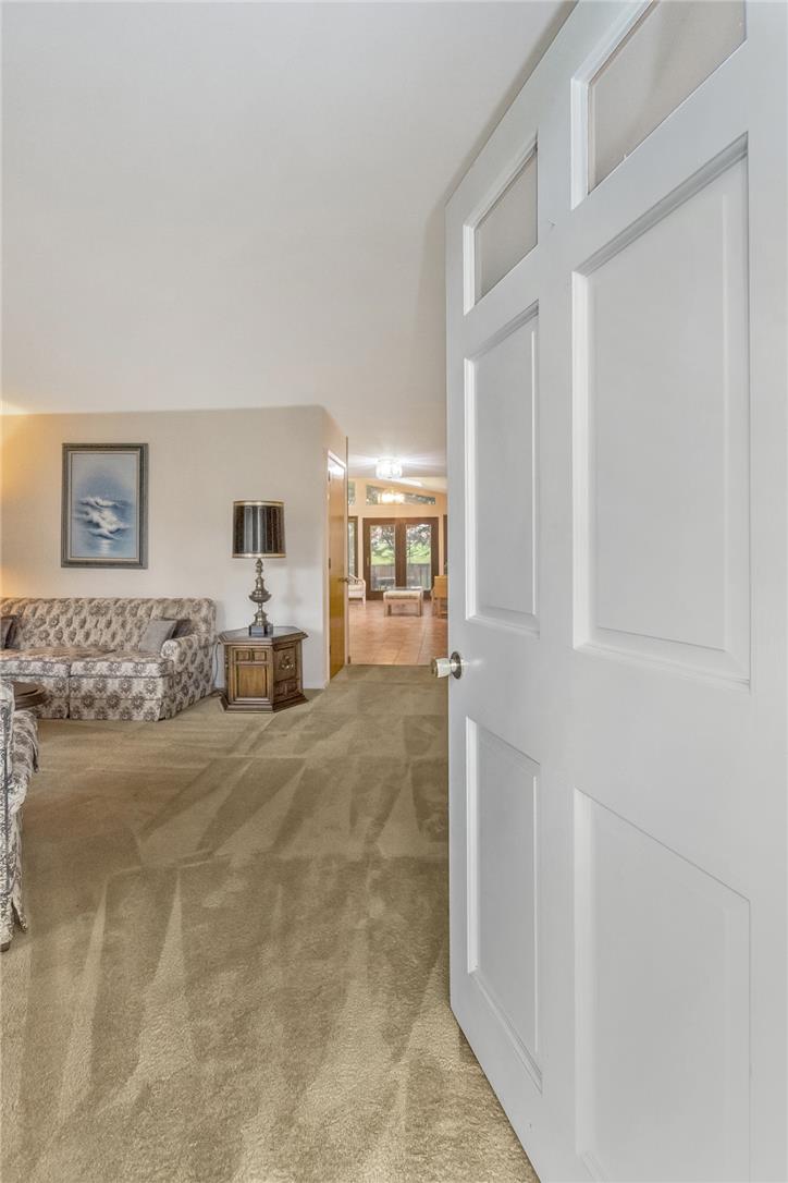 1328 Russett Road Allentown, PA 18104 - Photo 4 of 46 Enter into a welcoming interior with plush carpeting, leading to a bright, open space beyond.