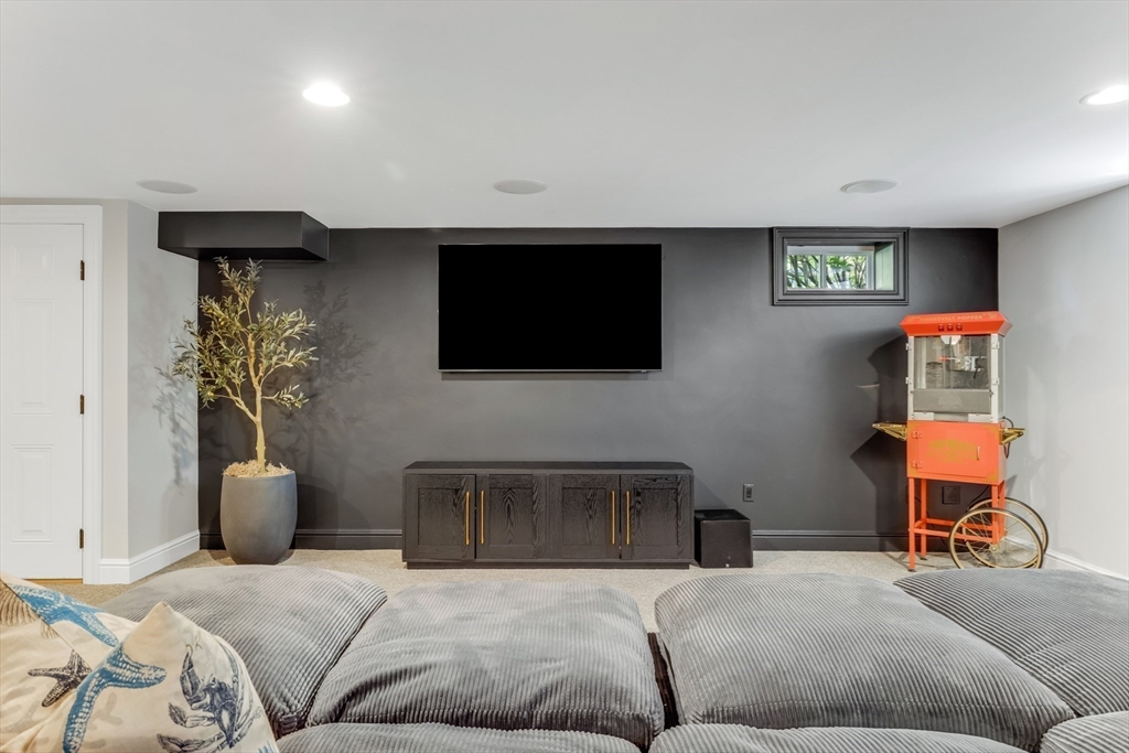 85 Old Farm Road Milton, MA 02186 - Photo 29 of 42 a living room with furniture and a flat screen tv