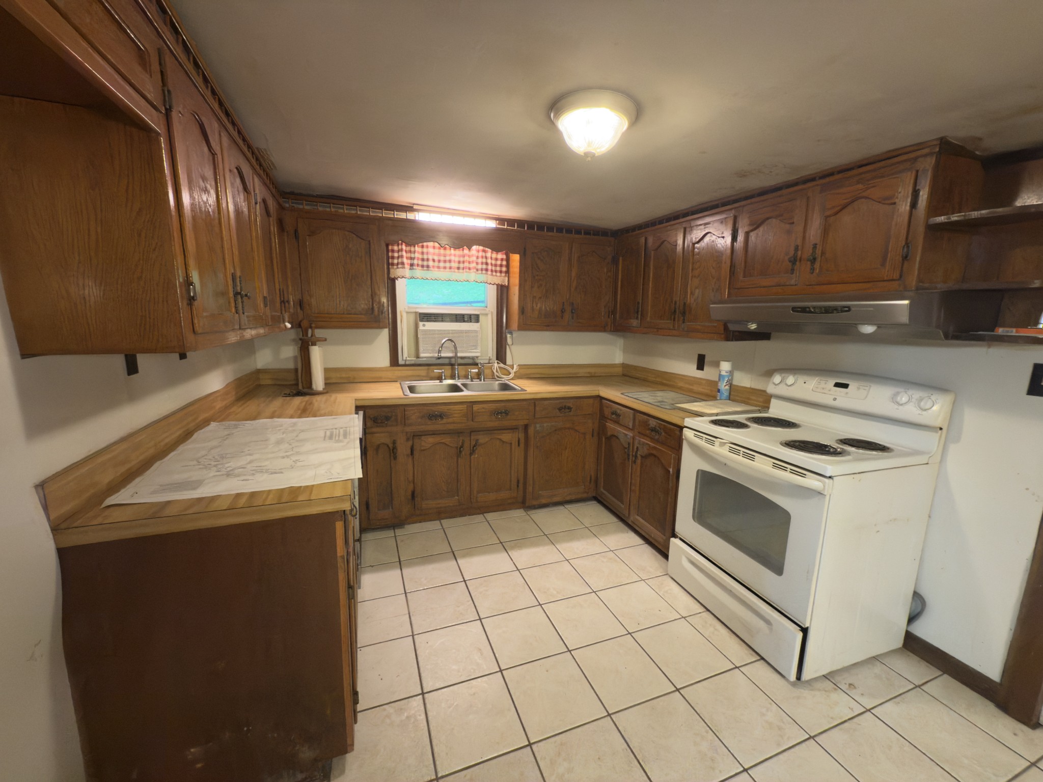 546 Womack Hollow Road Liberty, TN 37095 - Photo 26 of 43 a kitchen with a stove sink and cabinets