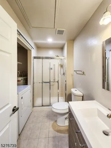 a spacious bathroom with a sink a toilet and shower
