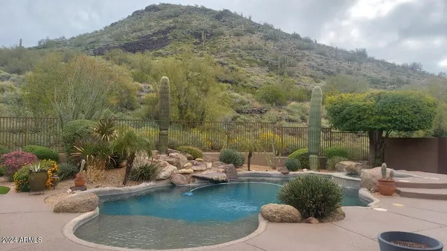 a view of a patio with couches and potted plants