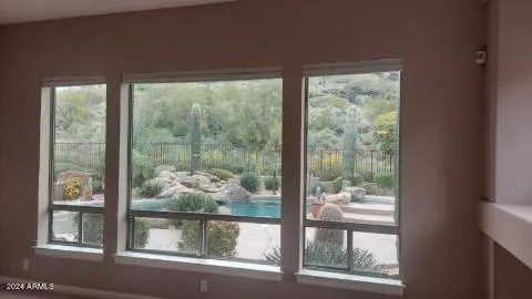 a kitchen with kitchen island a counter top space a sink stainless steel appliances and cabinets